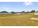 Expansive back yard features a white vinyl fence, offering privacy and a clear view of the neighborhood homes at 1209 Mattie Pointe Blvd, Auburndale, FL 33823