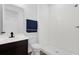 Bathroom with walk-in shower, dark vanity with undermount sink, and chrome plumbing fixtures at 1209 Mattie Pointe Blvd, Auburndale, FL 33823