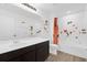 Bright bathroom featuring a vanity, bathtub with themed decals, and a shower featuring a themed shower curtain at 1209 Mattie Pointe Blvd, Auburndale, FL 33823