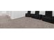 Entertainment space boasting plush carpeting, theater seating, and ample space for leisure activities at 1209 Mattie Pointe Blvd, Auburndale, FL 33823