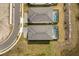 Overhead view of two houses with pools at 1242 Butterfly Orchid Rd, Davenport, FL 33837