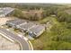 Desirable neighborhood aerial view, showcasing new construction homes with beautiful green spaces and landscaping at 1242 Butterfly Orchid Rd, Davenport, FL 33837
