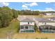Aerial view of home showcasing a private screened-in pool, spa and lush backyard at 1242 Butterfly Orchid Rd, Davenport, FL 33837
