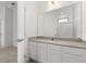 A bathroom featuring a large mirror, quartz countertop, and a single sink at 1242 Butterfly Orchid Rd, Davenport, FL 33837