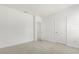 Bedroom featuring plush carpeting with ensuite bathroom and closet access at 1242 Butterfly Orchid Rd, Davenport, FL 33837