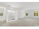 Spacious and bright bedroom featuring plush carpeting and a convenient laundry closet at 1242 Butterfly Orchid Rd, Davenport, FL 33837