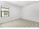 Bright bedroom with plush carpeting and a window with blinds offering natural light at 1242 Butterfly Orchid Rd, Davenport, FL 33837