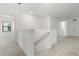 A hallway featuring carpet, bright walls, and a staircase leading to the first floor at 1242 Butterfly Orchid Rd, Davenport, FL 33837