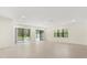 Open living area with access to backyard pool at 1242 Butterfly Orchid Rd, Davenport, FL 33837
