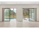 Sliding glass doors opening to pool and jacuzzi on the outdoor patio at 1242 Butterfly Orchid Rd, Davenport, FL 33837