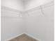 A walk-in closet featuring white walls, carpet, and wire shelving for storage at 1242 Butterfly Orchid Rd, Davenport, FL 33837