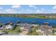 An aerial view showcases a beautiful lake community and many waterfront homes at 16629 Broadwater Ave, Winter Garden, FL 34787