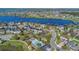 Stunning aerial view of waterfront community with lake access, featuring lush landscaping and community pool at 16629 Broadwater Ave, Winter Garden, FL 34787