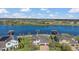 An aerial view shows a beautiful lake community with houses and docks at 16629 Broadwater Ave, Winter Garden, FL 34787
