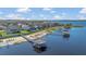 A scenic aerial view captures a lakeside community with private boat docks, providing easy access to the water for residents at 16629 Broadwater Ave, Winter Garden, FL 34787