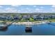 This aerial view highlights waterfront homes with boat docks, offering direct access to the tranquil waters of the lake at 16629 Broadwater Ave, Winter Garden, FL 34787