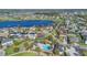 Beautiful aerial shot of a lakefront neighborhood with a community pool, playground, and well-maintained lawns at 16629 Broadwater Ave, Winter Garden, FL 34787