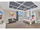 The bedroom includes a four-poster bed, large windows, and a modern ceiling design at 16629 Broadwater Ave, Winter Garden, FL 34787