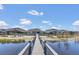 Exterior shot of a home with an extended dock and beautiful water views at 16629 Broadwater Ave, Winter Garden, FL 34787