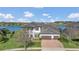 An aerial shot showcasing a luxurious lakefront property with a three car garage at 16629 Broadwater Ave, Winter Garden, FL 34787