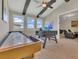The game room has a foosball table, pool table, and large windows at 16629 Broadwater Ave, Winter Garden, FL 34787