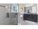 The main bathroom has a walk-in shower, soaking tub with tile surround, and granite countertop at 16629 Broadwater Ave, Winter Garden, FL 34787
