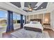 The main bedroom has large windows with a great view and a patterned ceiling with a ceiling fan at 16629 Broadwater Ave, Winter Garden, FL 34787