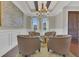 Cozy sitting room with coffered ceiling, chandelier lighting, and comfortable chairs is perfect for relaxation at 16629 Broadwater Ave, Winter Garden, FL 34787