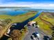 Gorgeous aerial view of a waterfront property, boat launch, and dock on a pristine lake. Perfect for boating! at 1720 Bridgets Ct, Kissimmee, FL 34744