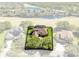 A home highlighted in an aerial view of a golf community near a lake at 1720 Bridgets Ct, Kissimmee, FL 34744