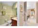 Powder bath featuring updated vanity, framed mirror, neutral paint and tile floors at 1720 Bridgets Ct, Kissimmee, FL 34744