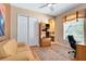 Cozy bedroom with a comfortable sofa, bookshelf, and a view leading into an attached bathroom at 1720 Bridgets Ct, Kissimmee, FL 34744