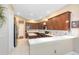 Well-lit kitchen with stainless steel appliances, white countertops, and dark cabinetry with ample storage space at 1720 Bridgets Ct, Kissimmee, FL 34744