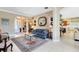Spacious living area with comfortable seating and an open floor plan with multiple archways at 1720 Bridgets Ct, Kissimmee, FL 34744