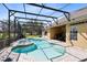 Enclosed pool area with jacuzzi overlooking the well-manicured golf course at 1720 Bridgets Ct, Kissimmee, FL 34744