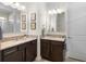 Stylish bathroom with double vanity, granite countertops, and contemporary fixtures at 17398 Blazing Star Cir, Clermont, FL 34714