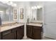 Bright bathroom featuring double vanity with granite counters and undermount sinks at 17398 Blazing Star Cir, Clermont, FL 34714