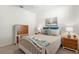 Cozy bedroom with neutral tones, matching nightstands and comfortable furnishings at 17398 Blazing Star Cir, Clermont, FL 34714