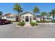 Beautiful community clubhouse featuring lush landscaping and convenient parking at 17398 Blazing Star Cir, Clermont, FL 34714