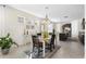 Dining area featuring natural light, modern decor, and convenient access to the kitchen and living spaces at 17398 Blazing Star Cir, Clermont, FL 34714
