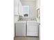 Functional laundry room with storage cabinets and modern appliances at 17398 Blazing Star Cir, Clermont, FL 34714