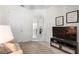 Comfortable living room with neutral tones, television and french doors at 17398 Blazing Star Cir, Clermont, FL 34714