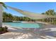 Inviting community swimming pool with covered seating and lounge chairs at 17398 Blazing Star Cir, Clermont, FL 34714