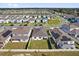 Aerial view of the community, showcasing well-maintained homes and landscaped yards at 1773 Groveline Rd, St Cloud, FL 34771