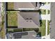 Top-down aerial shot of the house, highlighting its roof, backyard, and surroundings at 1773 Groveline Rd, St Cloud, FL 34771