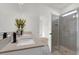 Bathroom features double vanity and glass-enclosed shower at 1773 Groveline Rd, St Cloud, FL 34771