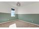 Stylish bedroom featuring painted paneling, neutral carpet and modern light fixture at 1773 Groveline Rd, St Cloud, FL 34771