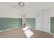 Stylish bedroom featuring painted paneling, neutral carpet and closet at 1773 Groveline Rd, St Cloud, FL 34771