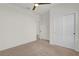 Bright bedroom with neutral carpet, ceiling fan, and closet at 1773 Groveline Rd, St Cloud, FL 34771