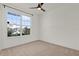 Cozy bedroom featuring neutral carpet, ceiling fan and ample natural light at 1773 Groveline Rd, St Cloud, FL 34771